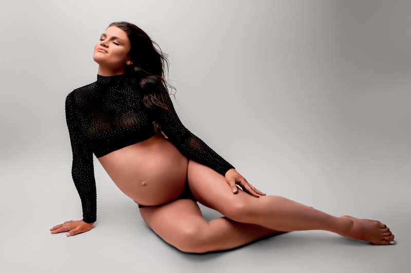 Moor Preset Pack, pregnant woman reclines on floor in photo studio