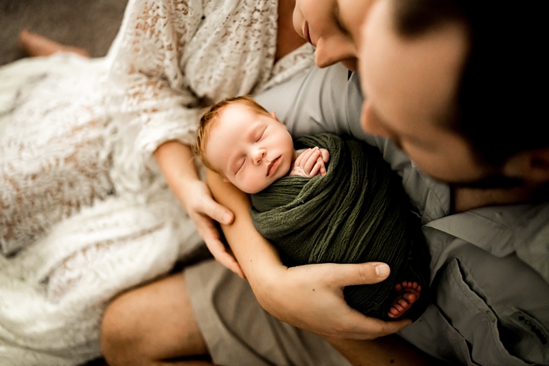 Moor Preset Pack, mom and dad dote on their newborn baby as holds him