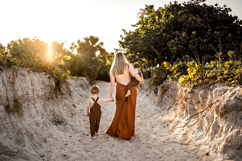 Salty Preset Pack, a young mother holds baby and her young sons hand as they walk on a sandy trail