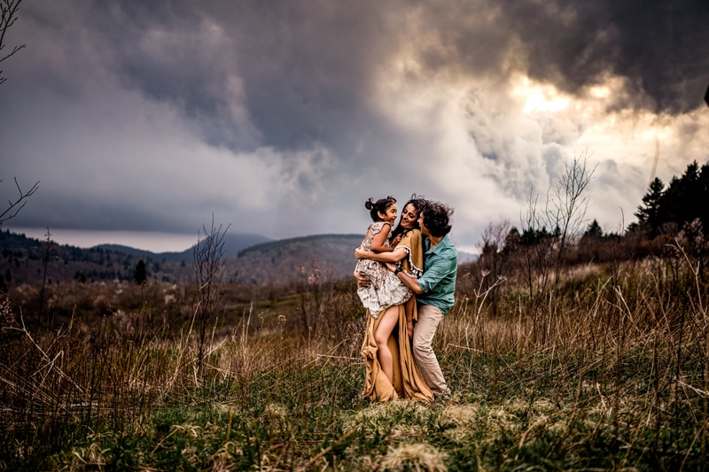 Salty Preset Pack, two women embrace as they hold a young girl in the tall grassy countryside