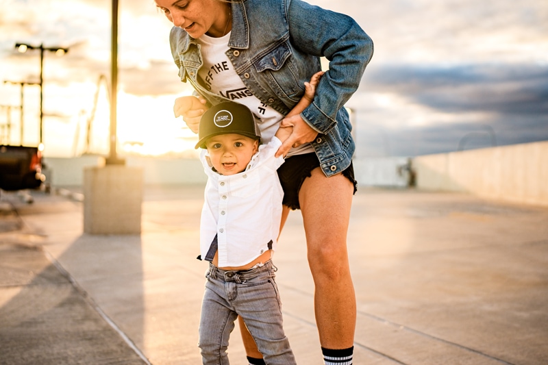 Salty Preset Pack, a mother holds onto her son atop an empty parking structure at golden hour