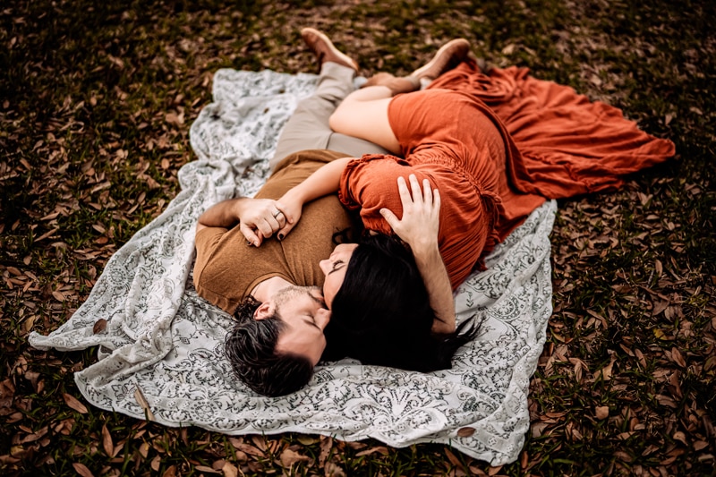 Salty Preset Pack, a man and woman cuddle on a blanket on top of fallen leaves