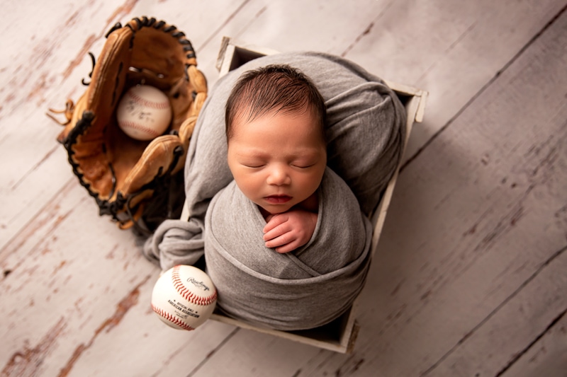 Moor Preset Pack, a baby boy is bundled in blankets in a small box, a baseball and baseball glove are beside him